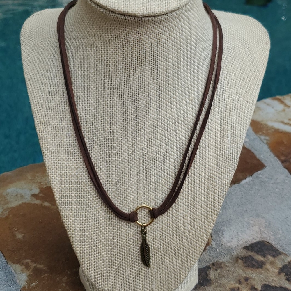 Double Brown corded necklace w circle and feather.